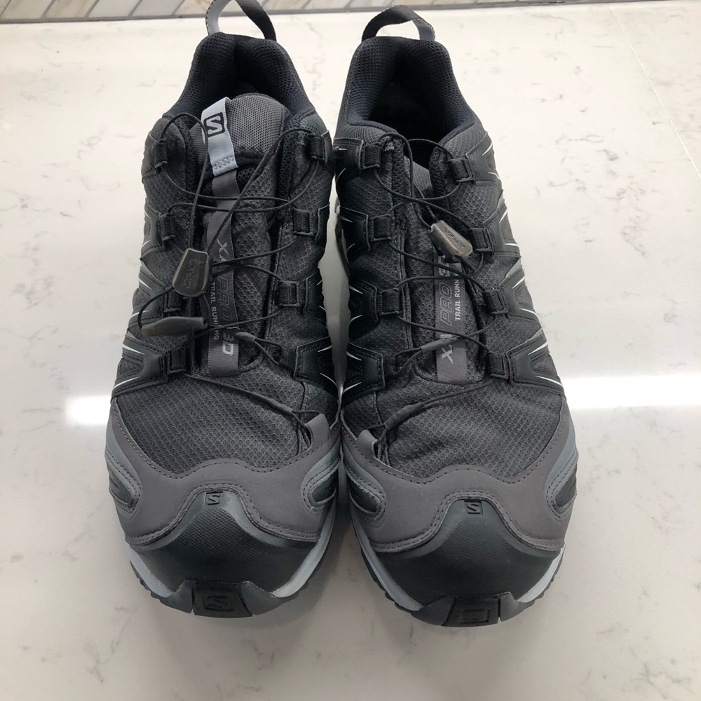 Salomon Pro 3D trail running shoes.